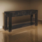 Mesa de sofá de madera con cuatro cajones y un estante, negro envejecido